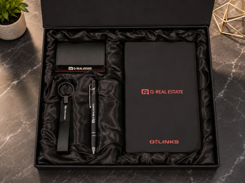 Branded corporate gift set for Q-Real Estate with diary, pen, keychain and card holder